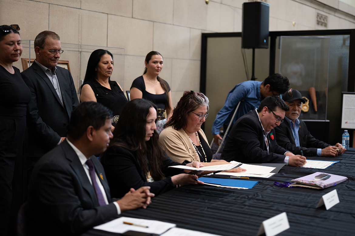 Minister Anandasangaree, the Grand Chief and Chiefs of the Anishinabe Algonquin Nation at the signing ceremony.